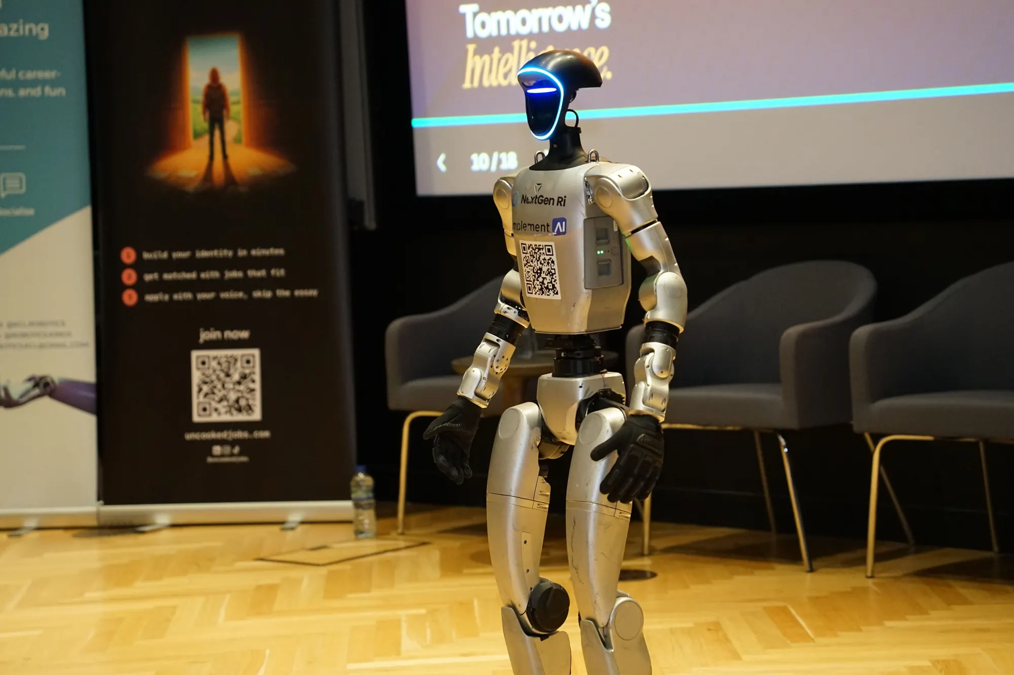 A humanoid robot standing on stage.